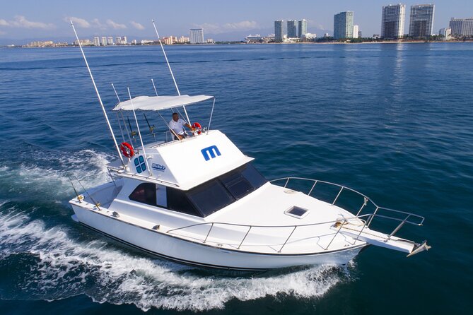 Bertram 38' Convertible Boat in Puerto & Nuevo Vallarta - Setting off in Puerto Vallarta: shoreline sightseeing that actually feels close