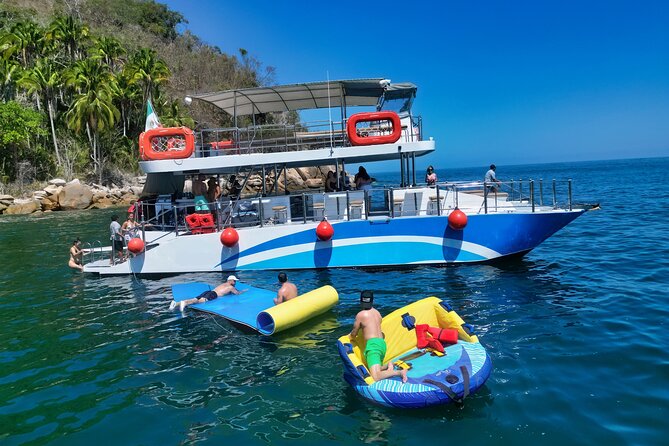 Mega Catamarans ALL INCLUSIVE Remote Paradise Beach Adventure - Watersports at the remote beach stop: snorkel, kayak, paddle board, and swim